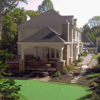 Putting green and covered outdoor living room residential