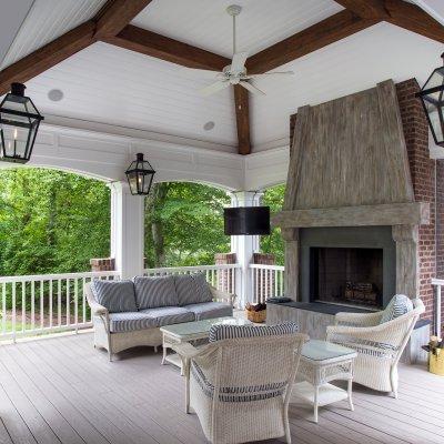 Outdoor Living addition with fireplace, couches,  gas lights, and ceiling fan  