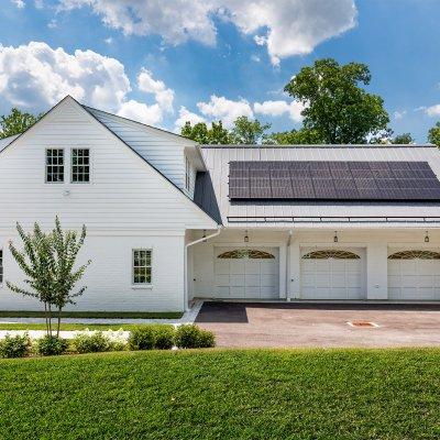 5-car residential garage with solar panels, side entrance