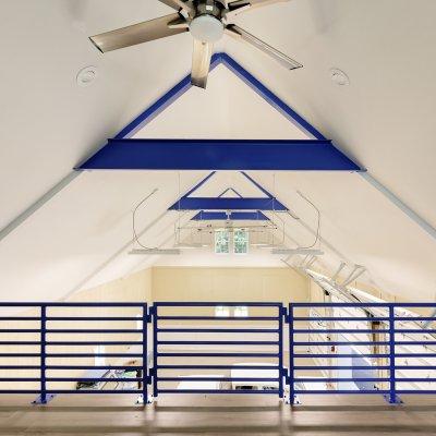 Interior Garage loft with blue roof trusses